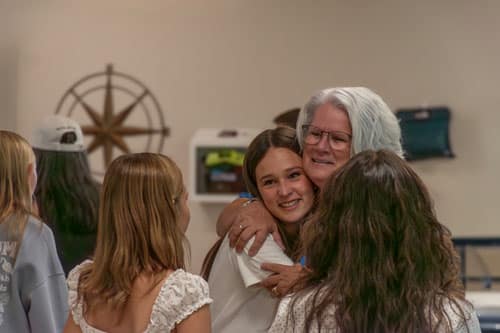 Bethany Papajohn Hugging Scholars