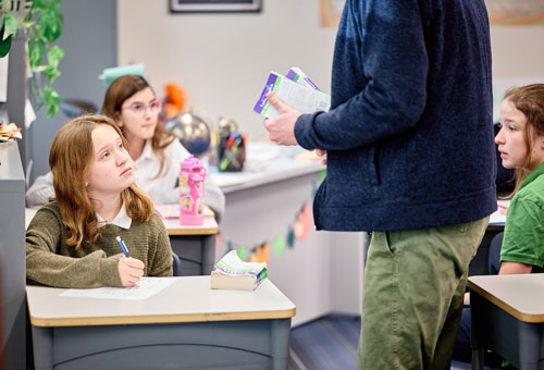 Scholar in a Leman classroom very engaged
