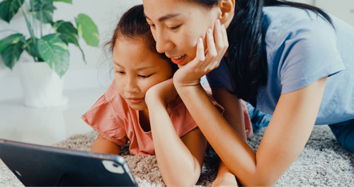 mother and daughter learning online