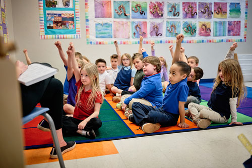 Scholars raising their hands