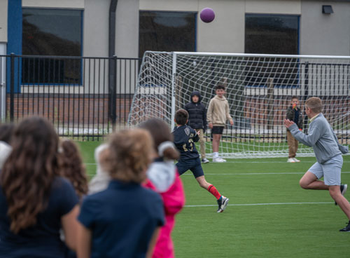 Young scholars playing soccer at the Leman Academy Stroh campus