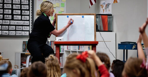Teacher in front of her class teaching at Leman Academy