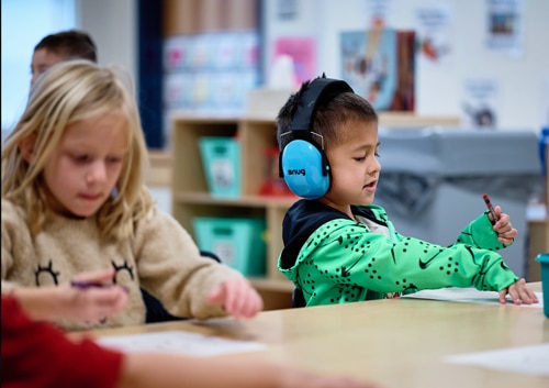 Bayou Gulch Pre-K scholar practicing handwriting and phonics