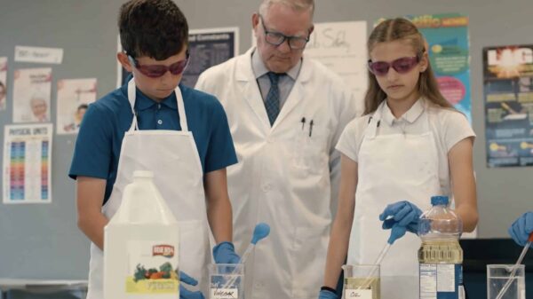 Science project with two scholars and a teacher