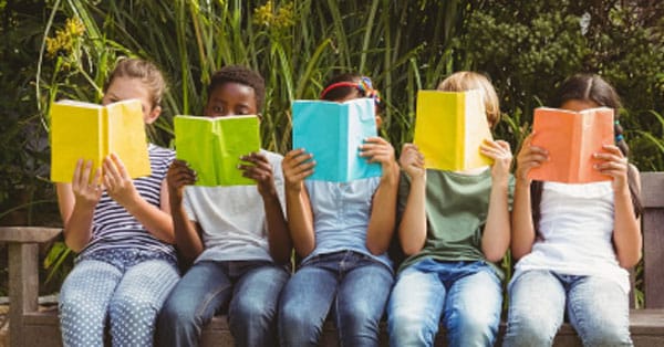 Kids reading books at Leman Academy