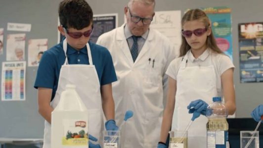 Science project with two scholars and a teacher